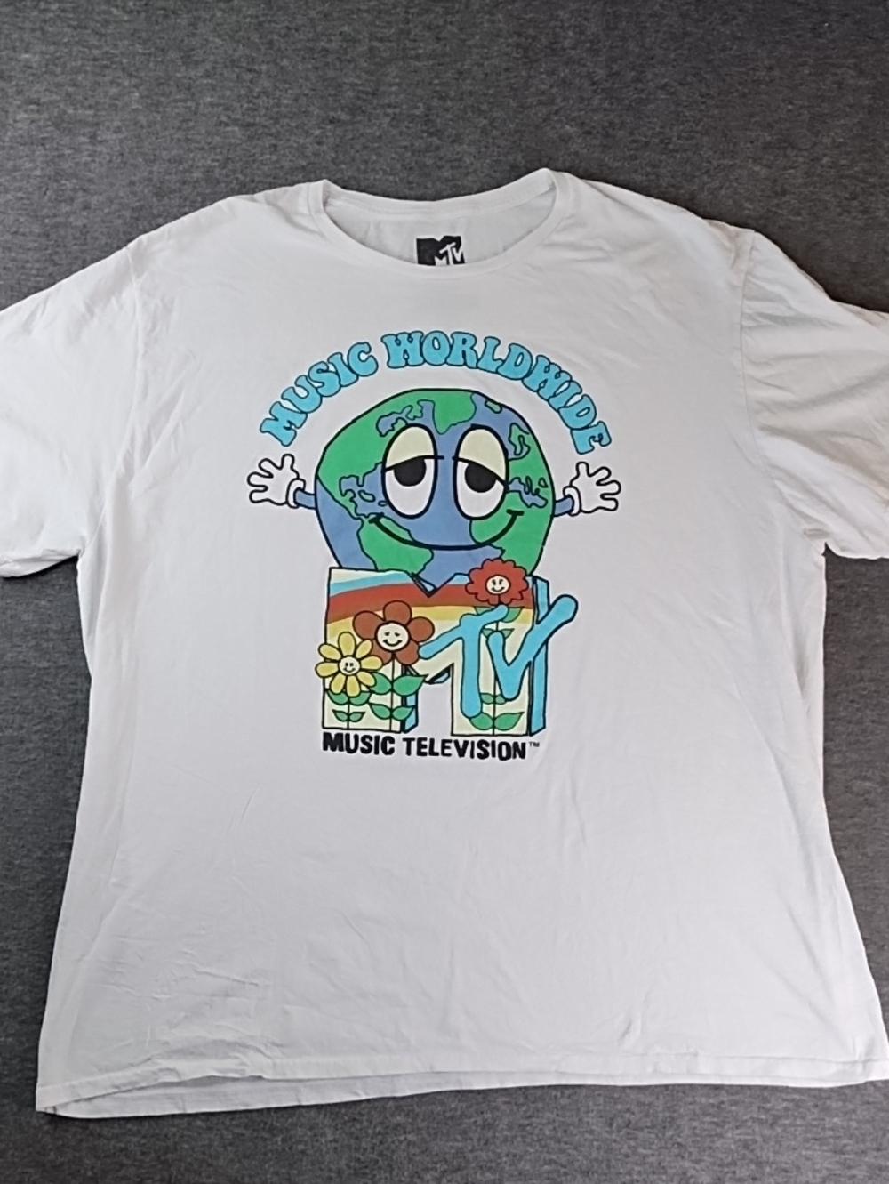 MTV White Graphic Tee with Colorful 'Music Worldwide' Globe